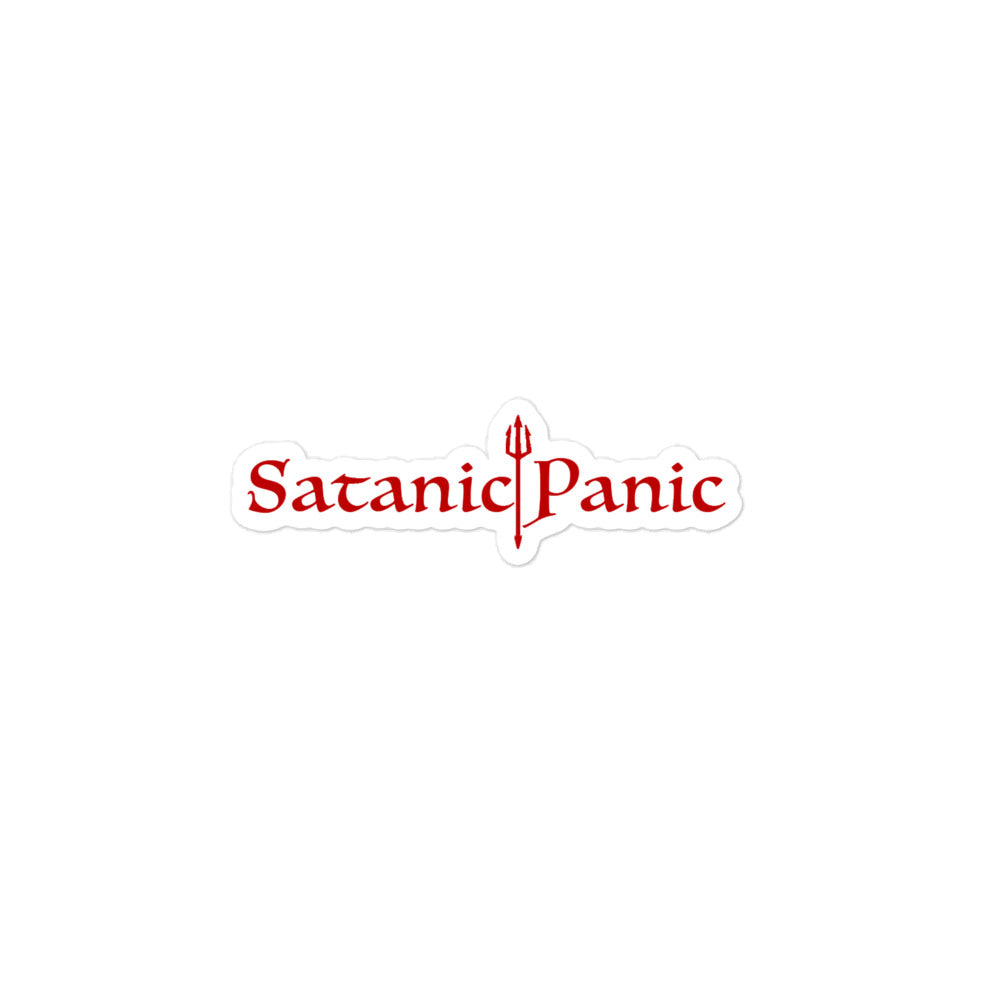 A red sticker with the text 'SATANIC PANIC' and a graphic symbol, likely to be applied on a surface for decorative or expressive purpose.
